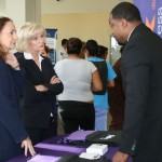 Commissioner Murman speaks with Darius Kelley of FedEx, one of 30 employers at her South County Job Fair; nearly 250 people attended the event