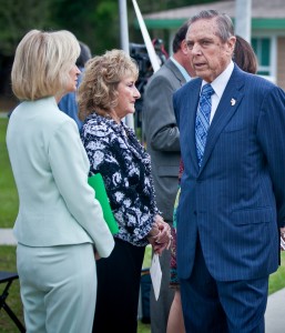 Commissioner Murman speaks with Governor Bob Martinez and Mary Jane Martinez at the County Children's Services Girls Shelter named for Mary Jane Martinez.