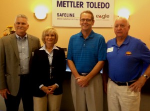 Commissioner Sandy Murman visits with Mettler-Toledo Safeline Inc.'s General Manager, Viggo Nielson, (3rd from left), Ron Barton, Director of Economic Development for Hillsborough County (left) and Jerry Custin, President/CEO of the Upper Tampa Bay Chamber.