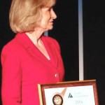 Commissioner Sandy Murman accepts Junior Achievement's National Bronze Leadership Award for her volunteer work with youth in the community.