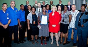 The full staff for Hillsborough County's Sunshine Line program and Director Ed Wisniewski stand with Sandy after receiving a commendation for stellar work while serving as the transportation system for the disadvantaged in the County.