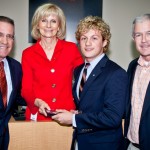 Sandy presents a Youth Excellence & Achievement or YEA! Award to Jesuit High School student Zack Aldridge for his volunteer work with Metropolitan Ministries.