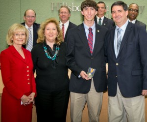 Sandy presented Derek Frantz of Jesuit High School with the Volunteer or Community Service YEA! Youth Excellence and Achievement Award along with his mother and father.