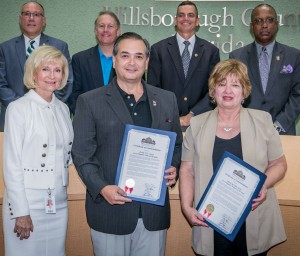 Commissioner Sandy Murman commends Colonel Evelio Otero and Maria Del Pilar Ortiz for being named as Tampa Hispanic Heritage's Hispanic Man and Hispanic Woman of the Year.