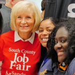 Sandy takes time with Amazon staff at her South County Job Fair held at HCC SouthShore. Amazon was hiring for hundreds of positions along with 40 other employers.