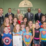 Commissioner Sandy Murman proclaimed February 4th as Superhero Day in Hillsborough County to honor the life of Austin Bradley Coates. On hand were Maria and Brad Coates, April, Aubrie and Brogan Coates, Melanie Morrison, Kate, Roxy and Ginger Morrison, and Leilani Warbritton with Kennedy, Hunter and Jansen Warbritton.