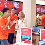 Sandy applauds Microsoft employees during the opening of its new store at International Mall.