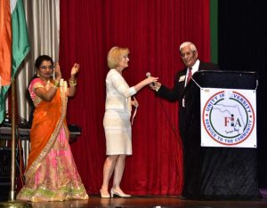 Sandy spoke to a crowd of 1,000 at the India Independence Day event with Satish K. Sharma, president of the FIA.