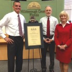 Commissioner Murman and County Administrator Mike Merrill honor outgoing Commissioner Mark Sharpe at his final BOCC meeting.