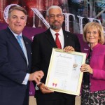 Commissioner Sandy Murman and Paul Anderson present Panama Canal Deputy Administrator Manuel Benítez with a proclamation from the county, proclaiming Panama Canal Appreciation Day.